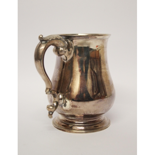 556 - A Victorian silver pint tankard, shallow engraved initials. London marks Henry Holland, 1865. 12 cms... 