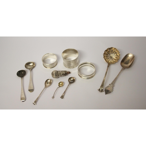 559 - A collection of small silver ware - napkin rings, sifting spoons, salt spoons etc