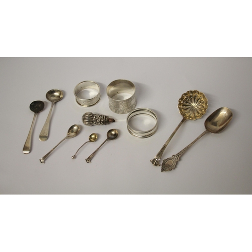 559 - A collection of small silver ware - napkin rings, sifting spoons, salt spoons etc