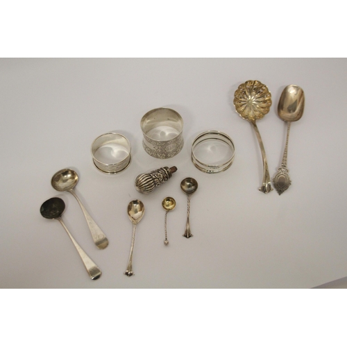 559 - A collection of small silver ware - napkin rings, sifting spoons, salt spoons etc