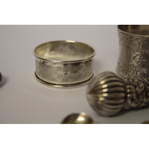 559 - A collection of small silver ware - napkin rings, sifting spoons, salt spoons etc