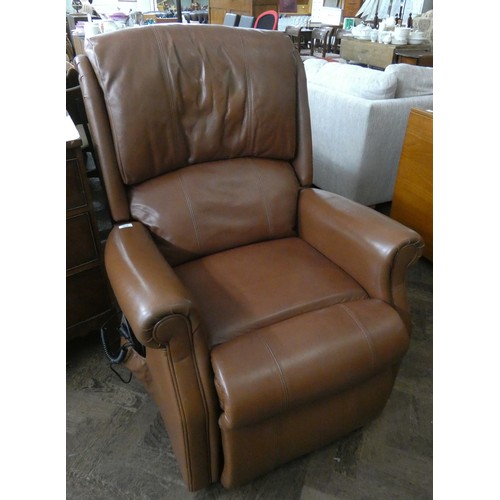 263 - An HSL electric rise and recline easy chair in brown leather