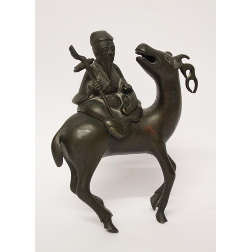 320 - A Chinese bronze figure of a sage astride an antelope, 7