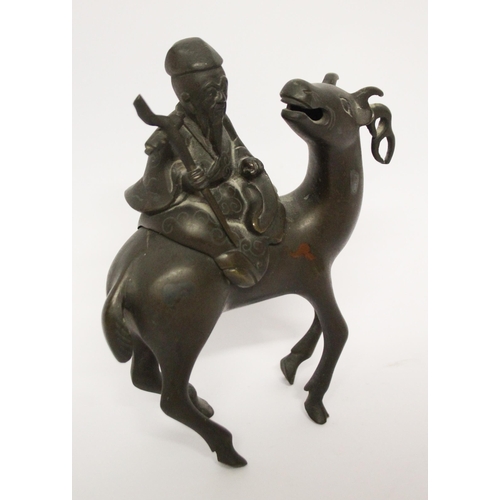 320 - A Chinese bronze figure of a sage astride an antelope, 7