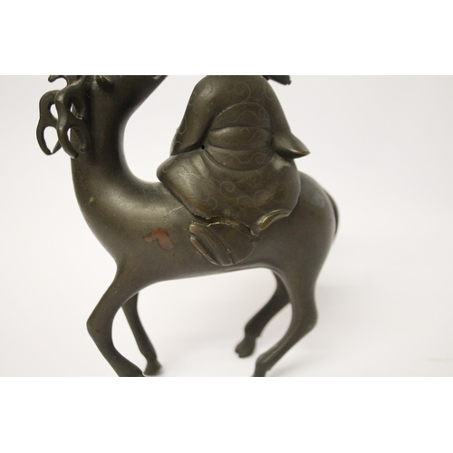 320 - A Chinese bronze figure of a sage astride an antelope, 7