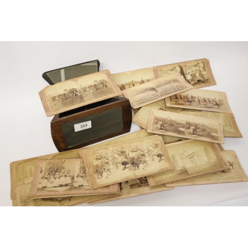 324 - A Victorian walnut stereoscope and Boer War viewing cards