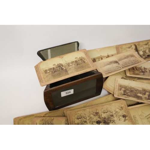 324 - A Victorian walnut stereoscope and Boer War viewing cards