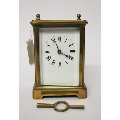 327 - A French gilt brass carriage clock with key and leather case, handle currently detached