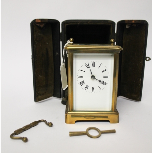 327 - A French gilt brass carriage clock with key and leather case, handle currently detached