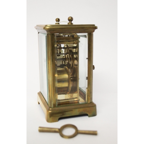 327 - A French gilt brass carriage clock with key and leather case, handle currently detached