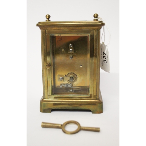 327 - A French gilt brass carriage clock with key and leather case, handle currently detached