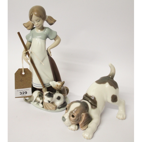 329 - Lladro figurine of a girl playing with kittens and a puppy with a ball