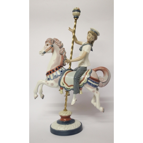 330 - Lladro figurine of a boy riding a carousel horse, approximately 40cms tall