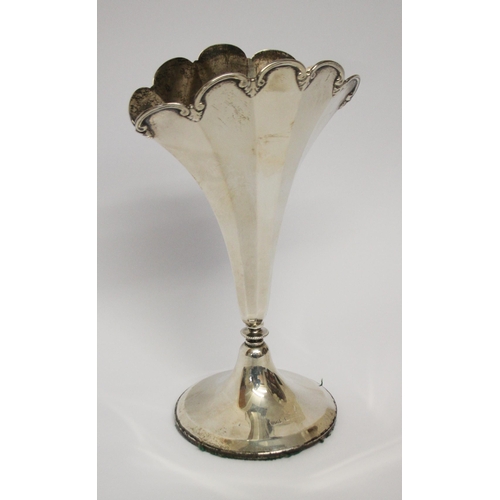 544 - A fan shaped silver trumpet case, on circular weighted base. Approx 18 cms tall