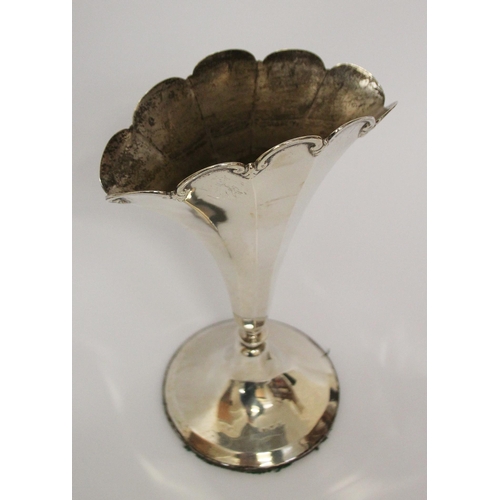 544 - A fan shaped silver trumpet case, on circular weighted base. Approx 18 cms tall