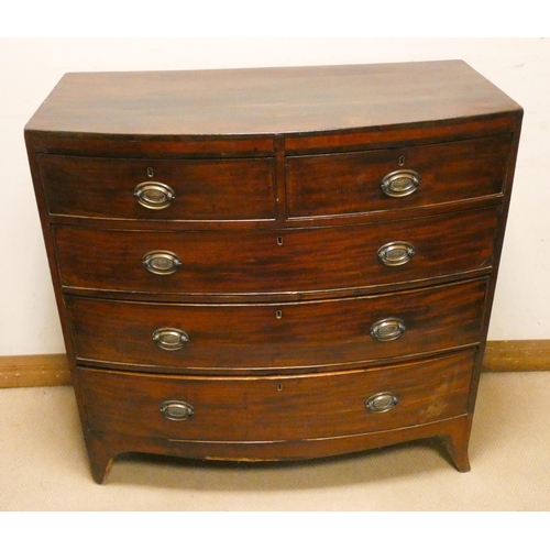 404 - A Georgian mahogany bow front chest of three long and two short drawers with brass handles, standing... 