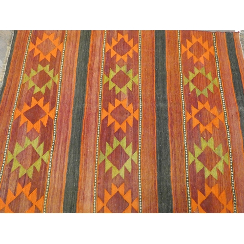 470 - An orange and patterned wool pile Kilim rug 5'6 x 4'6