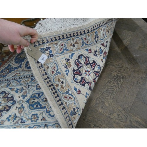 261 - A fawn and patterned Persian design wool pile rug, 11' x 6'9