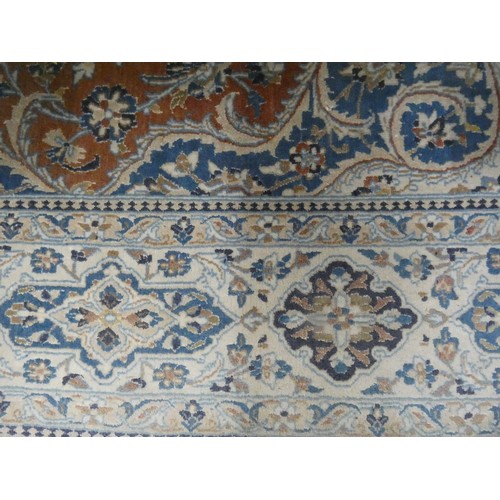 261 - A fawn and patterned Persian design wool pile rug, 11' x 6'9