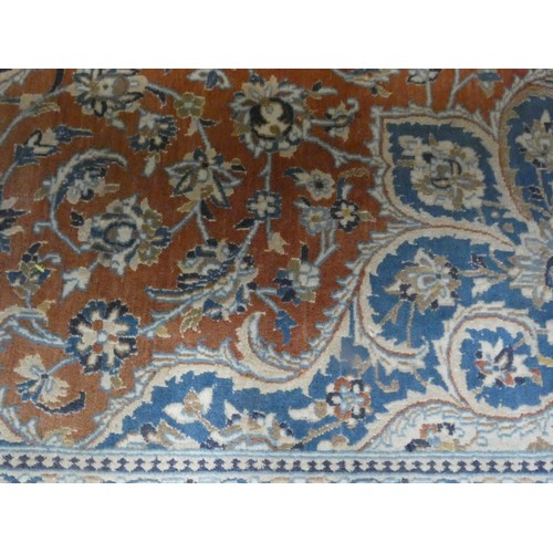 261 - A fawn and patterned Persian design wool pile rug, 11' x 6'9