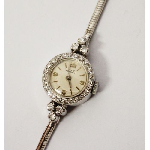 591 - A Girard Perregaux diamond cocktail watch, with cream colour circular dial, with baton hourly marker... 