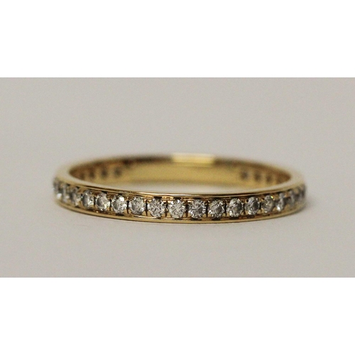 613 - Modern full diamond set eternity ring, in hallmarked 18ct yellow gold. Ring size M