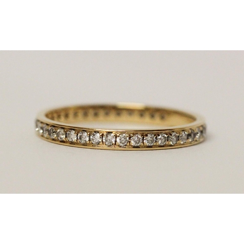 613 - Modern full diamond set eternity ring, in hallmarked 18ct yellow gold. Ring size M