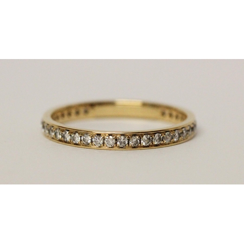 613 - Modern full diamond set eternity ring, in hallmarked 18ct yellow gold. Ring size M