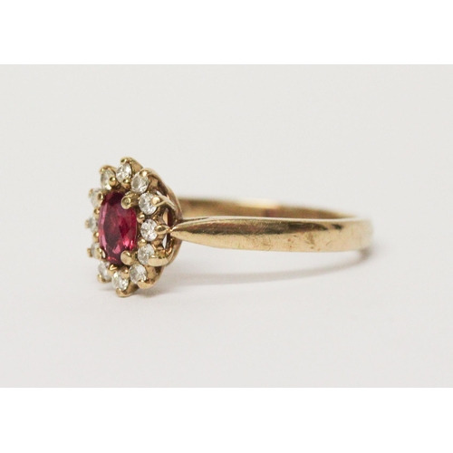 614 - Modern ruby and diamond oval cluster ring on 9ct yellow gold band, ring size M