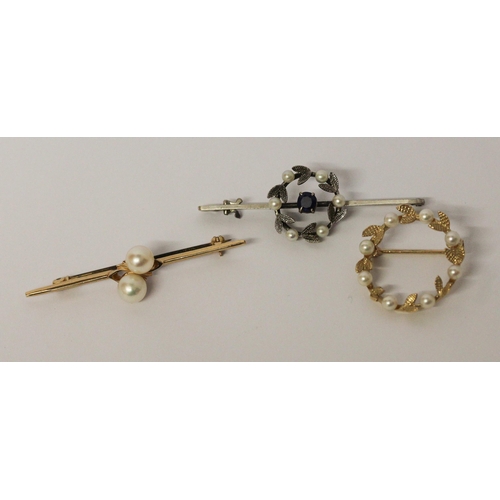 618 - A 9ct gold bar brooch set two cultured pearls, a pearl set 9ct gold wreath brooch and a 9ct white go... 