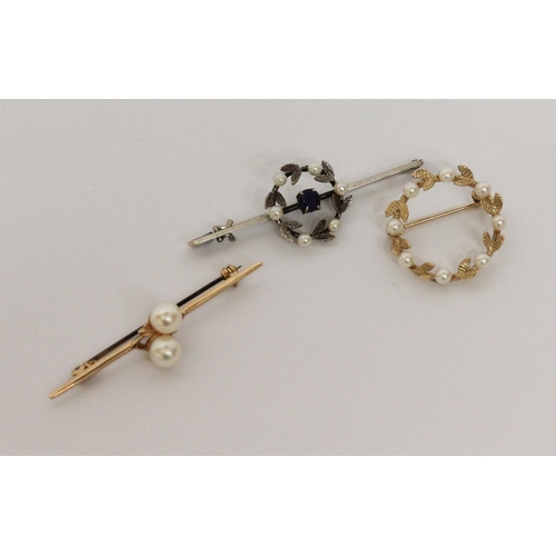 618 - A 9ct gold bar brooch set two cultured pearls, a pearl set 9ct gold wreath brooch and a 9ct white go... 