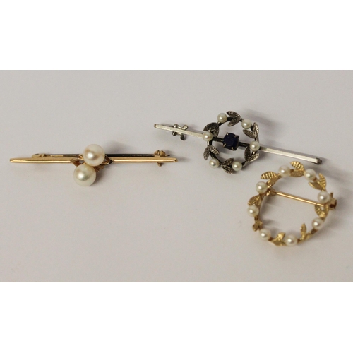 618 - A 9ct gold bar brooch set two cultured pearls, a pearl set 9ct gold wreath brooch and a 9ct white go... 