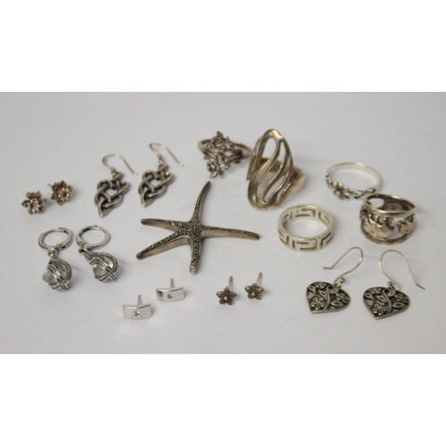 622 - A collection of silver earrings, marcasite starfish pendant and five ladies silver dress rings.