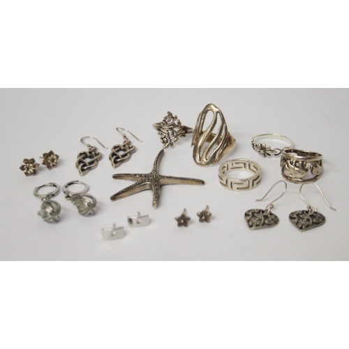 622 - A collection of silver earrings, marcasite starfish pendant and five ladies silver dress rings.