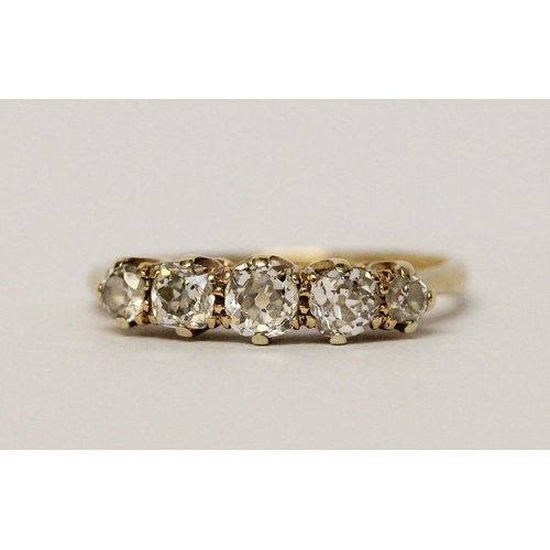 627 - A vintage five stone diamond ring, in 18ct yellow gold band. Ring size P 1/2. Weight 2.7g