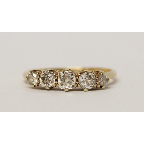 627 - A vintage five stone diamond ring, in 18ct yellow gold band. Ring size P 1/2. Weight 2.7g