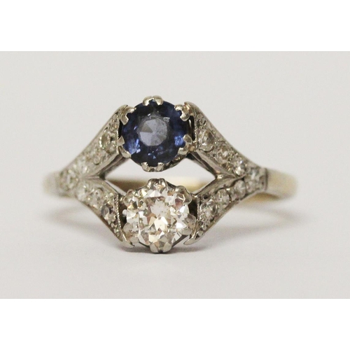 628 - An Art Deco two stone sapphire and diamond ring, in openwork diamond set mount, unmarked white preci... 