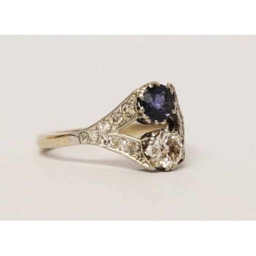 628 - An Art Deco two stone sapphire and diamond ring, in openwork diamond set mount, unmarked white preci... 