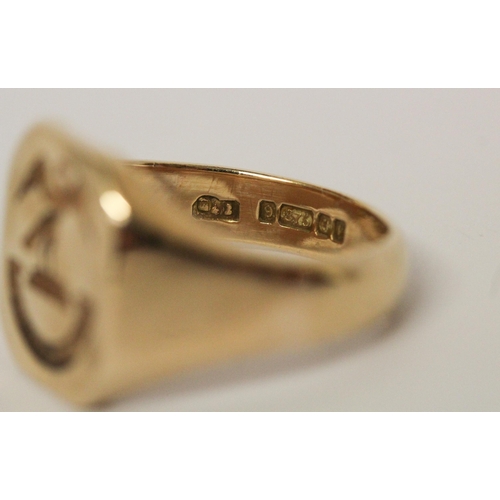 635 - A gold intaglio seal panel signet ring, hallmarked 9ct gold, ring size S, weight 10 g