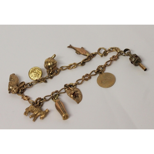 643 - A 9ct gold charm bracelet, set with animal and other 9ct gold charms. gross weight 21.6 g, 19 cms lo... 