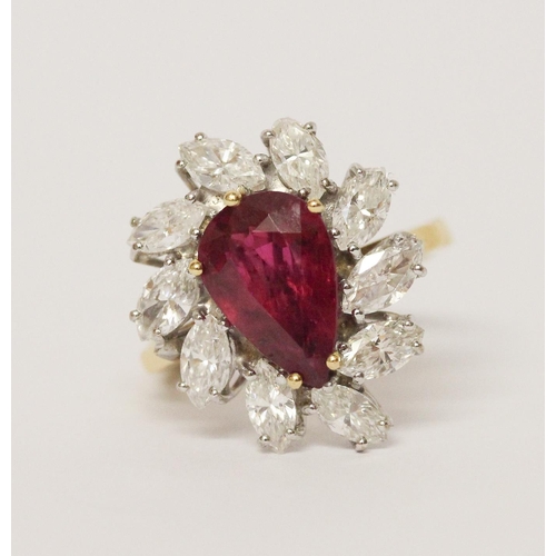 655 - A ruby and diamond cluster ring, The claw set pear shaped ruby surrounded by marquise shaped diamond... 