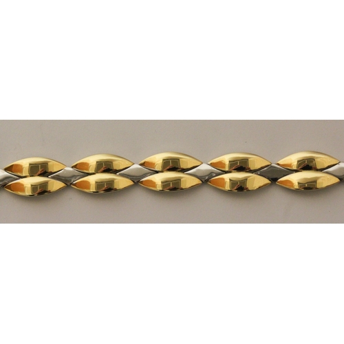 657 - A modern 18ct bi-colour gold bracelet, by Michael Platt, of smooth polished leaf style plaited desig... 