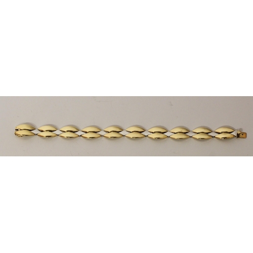 657 - A modern 18ct bi-colour gold bracelet, by Michael Platt, of smooth polished leaf style plaited desig... 