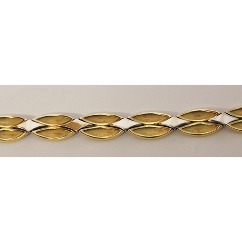 657 - A modern 18ct bi-colour gold bracelet, by Michael Platt, of smooth polished leaf style plaited desig... 