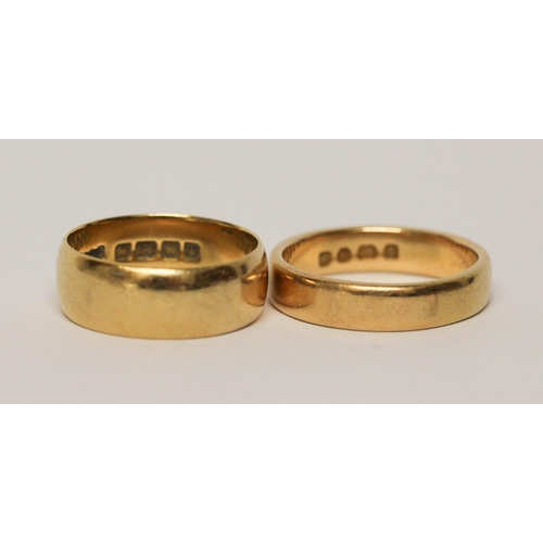 661 - Two 18ct yellow gold wedding bands, 14.4 grams. Ring size wider band P, narrower band S.