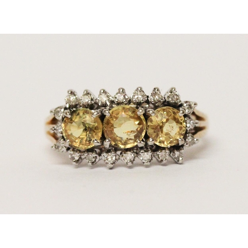 663 - A vintage 14ct gold three stone yellow topaz and diamond cluster ring. Shank marked 585. Ring size M... 