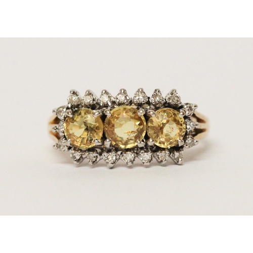 663 - A vintage 14ct gold three stone yellow topaz and diamond cluster ring. Shank marked 585. Ring size M... 