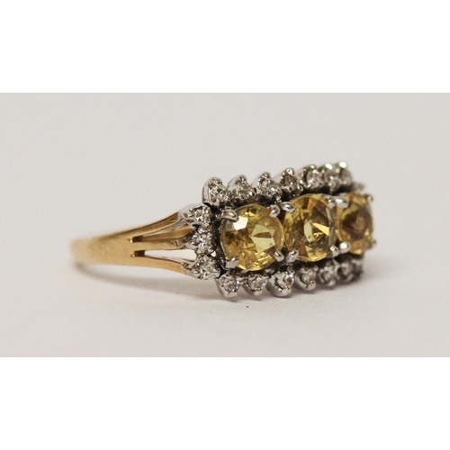 663 - A vintage 14ct gold three stone yellow topaz and diamond cluster ring. Shank marked 585. Ring size M... 