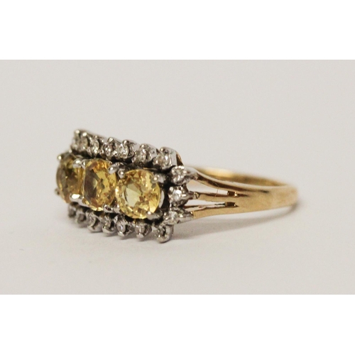 663 - A vintage 14ct gold three stone yellow topaz and diamond cluster ring. Shank marked 585. Ring size M... 