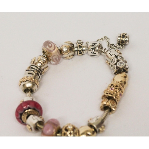 665 - Pandora - a good modern charm bracelet, the silver bracelet set with numerous 14k yellow gold, silve... 